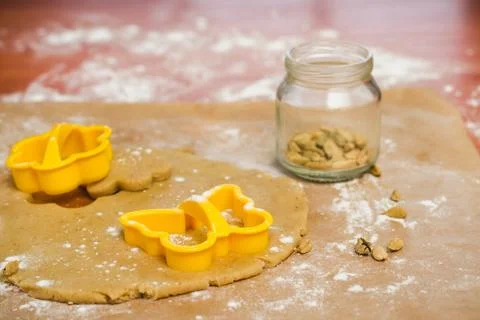 Process of cutting gingerbread in the form of butterflies and flowers Stock Photos
