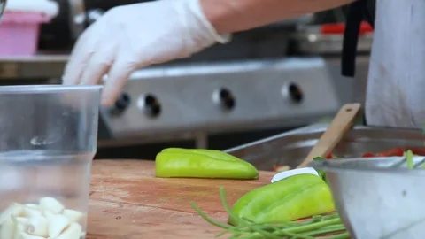 The process of cutting green bulgarian pepper and tomatoes Stock Footage 107533953
