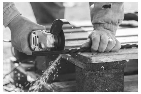 The process of cutting metal using the angle grinder, workflow Fotos Stock