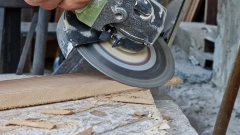 The process of cutting or grinding tiles with an angle grinder 動画素材 346035923