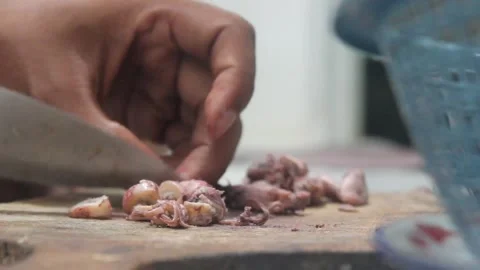 The process of cutting squid meat to make fried chili sauce. Stock Footage 276148475
