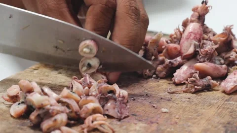 The process of cutting squid meat to make fried chili sauce. Stock Footage 276148679