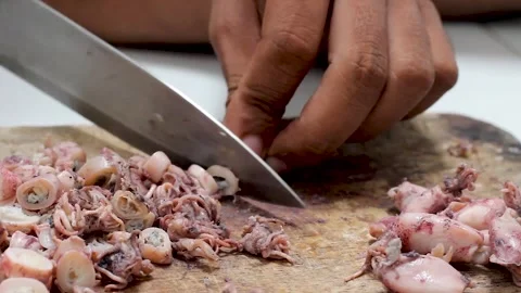The process of cutting squid meat to make fried chili sauce. Stock Footage 276148731