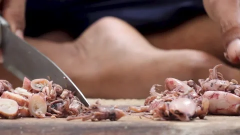 The process of cutting squid meat to make fried chili sauce. Stock Footage 276148875