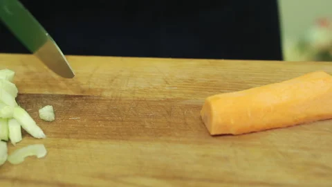 The process of cutting vegetables with a kitchen knife. Stock Footage 171624917