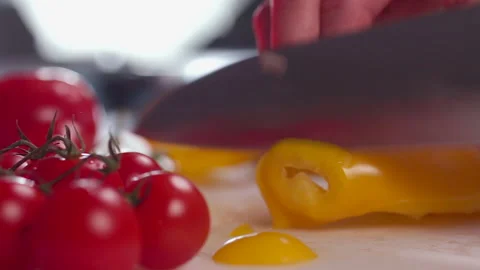 Process of cutting yellow pepper with large kitchen knife close-up Stock Footage 172416501