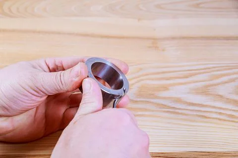 The process of deburring metal. Deburring tool for metal, wood, aluminum, cop Stock Photos