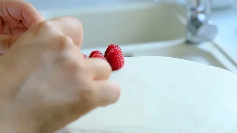 Process decorating berries cream cake. Stock Footage 113014721