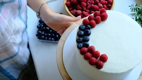 Process decorating berries cream cake. Stock Footage 113015139