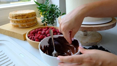 Process decorating berries cream cake. Stock Footage 113015322