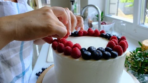 Process decorating berries cream cake. Stock Footage 113015917