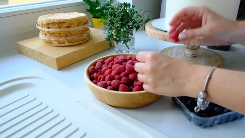 Process decorating berries cream cake. Stock Footage 113015998