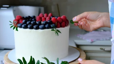 Process decorating berries cream cake. Stock Footage 113016241