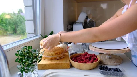 Process decorating berries cream cake. Stock Footage 113016263