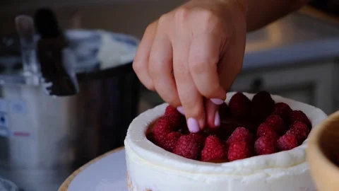 Process decorating berries cream cake. Stock Footage 113017227