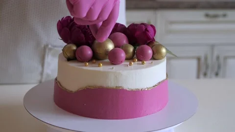 Process of decorating a birthday cake. Stock Footage 135608891