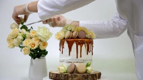Process of decorating a birthday cake on a white background Stock-Footage 149840444