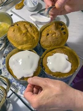 Process of decorating a cake with sweet colored decorations, concept of coo.. Stock Photos