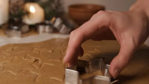 The process of decorating Christmas cookies is in motion. Close-up of a woman Video stock 169336658