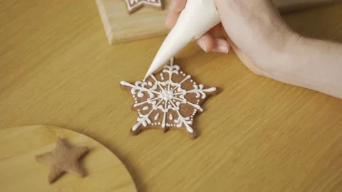 The process of decorating Christmas cookies is in motion Stock Footage 211016094