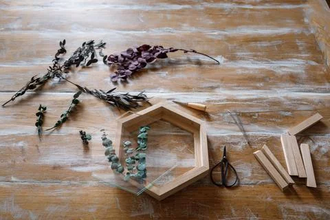 The process of decorating do it yourself. woman works with flowers in a small Stock Photos