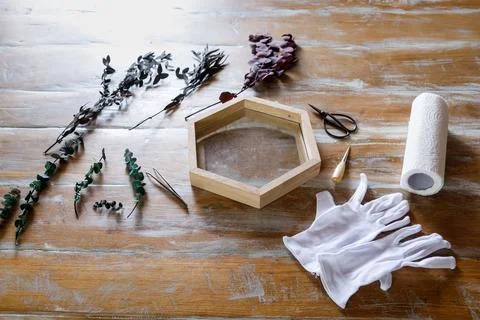 The process of decorating do it yourself. woman works with flowers in a small Stock Photos