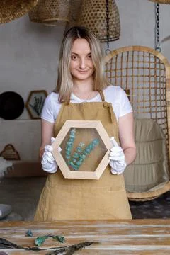The process of decorating do it yourself. woman works with flowers in a small Stock Photos