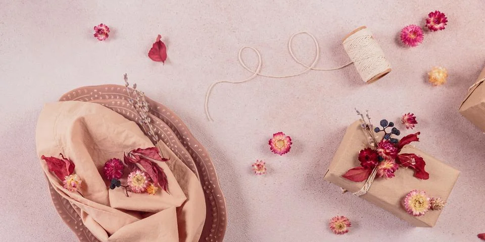 Process of decorating festive autumn table setting with dried flowers Stock Photos