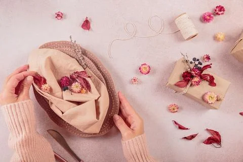 Process of decorating festive autumn table setting with dried flowers Stock Photos