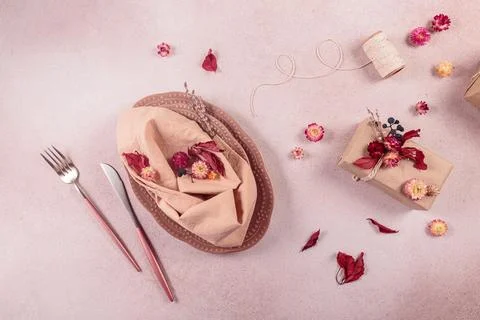 Process of decorating festive autumn table setting with dried flowers 写真素材