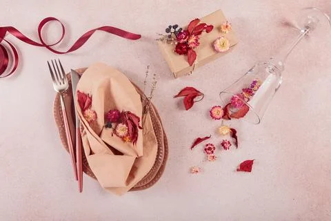 Process of decorating festive autumn table setting with dried flowers Stock Photos