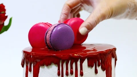 The process of decorating top of the cake with macaroons Stock Footage 106614403
