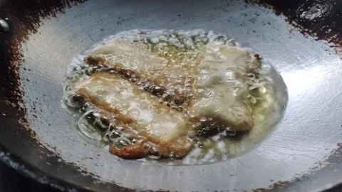 The Process of Deep-frying Tempeh Stock Footage 319723119