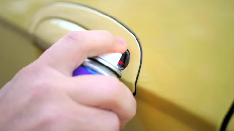 Process of defrosting car lock using a special spray Stock-Footage 144703207
