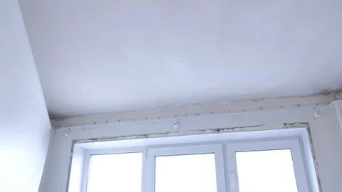 Process of demontage of stretch suspended ceiling in apartments. Stock Footage 123779556