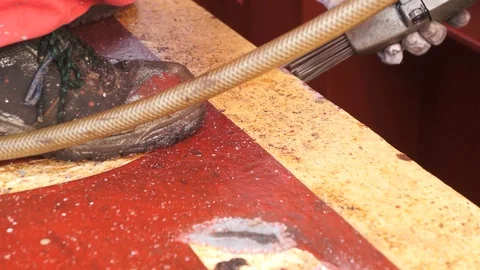 Process of derusting, paint and rust removal by pneumatic chisel from ship deck  Stock Footage 127164618