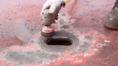 Process of derusting, paint and rust removal by pneumatic grinder from ship deck Stock Footage 127164670