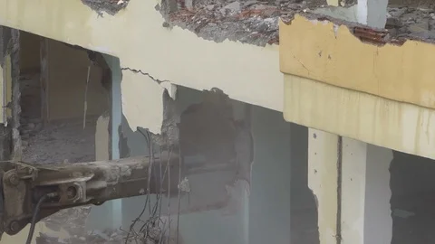 The process of destruction of the old building with heavy machinery Stock Footage 81928660