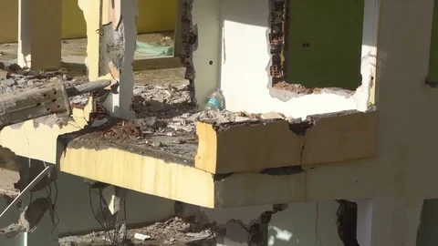 The process of destruction of the old building with heavy machinery Stock Footage 81931074