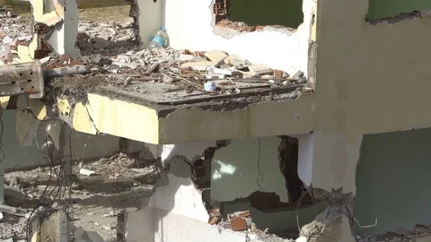 The process of destruction of the old building with heavy machinery Stock-Footage 81933065