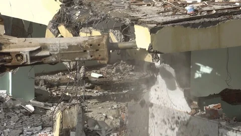 The process of destruction of the old building with heavy machinery Stock Footage 81934205