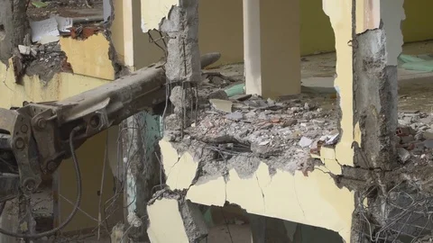 The process of destruction of the old building with heavy machinery Stock Footage 81934684