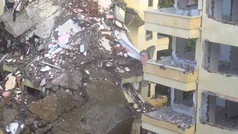 The process of destruction of the old building with heavy machinery Stock Footage 81991899