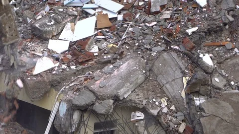 The process of destruction of the old building with heavy machinery Stock Footage 81993551