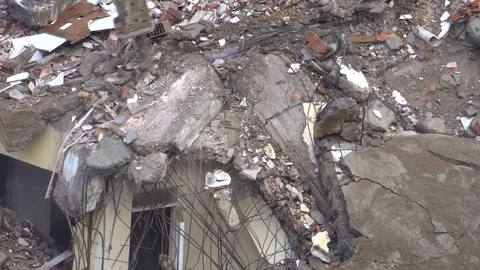 The process of destruction of the old building with heavy machinery Stock Footage 81994414