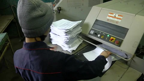 The process of destruction of paper documents on an industrial shredder Stock Footage 105132654