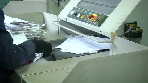 The process of destruction of paper documents on an industrial shredder Stock Footage 105133315