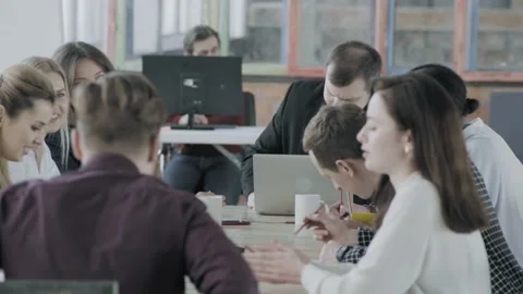 The process of discussing a project by a team of managers. The head of the Stock Footage 134159599