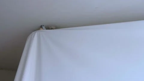 Process of dismantling of stretch suspended ceiling in flat, closeup view. Stock Footage 146163536