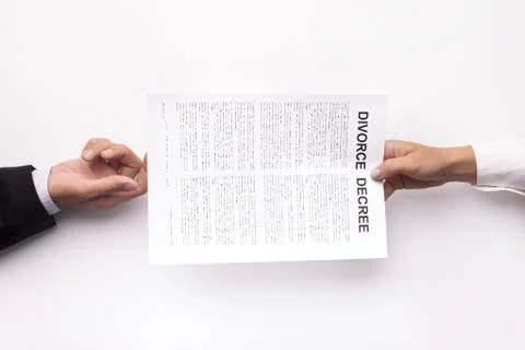 Process of divorce decree documents transferring on white 库存照片